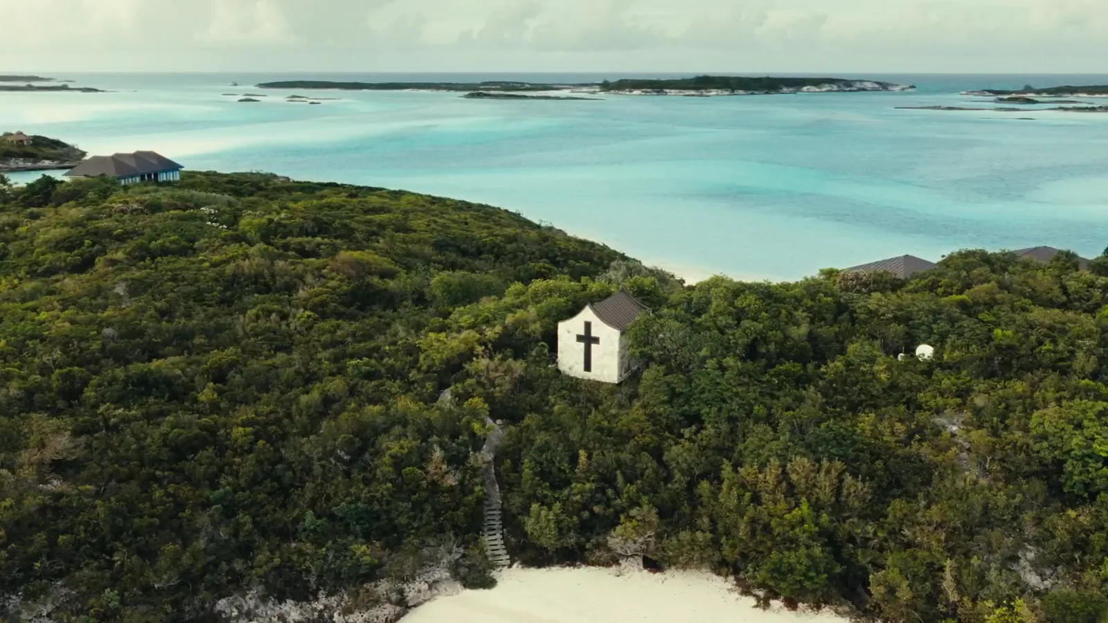 Little Pipe Cay from the air, the chapel in the trees