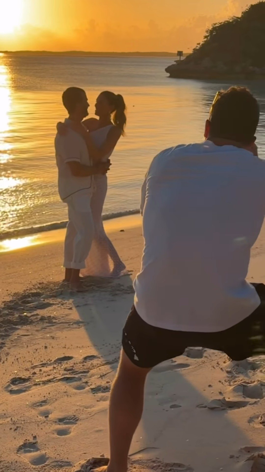 Kevin Wolf filming the ceremony at sunset on Little Pipe Cay